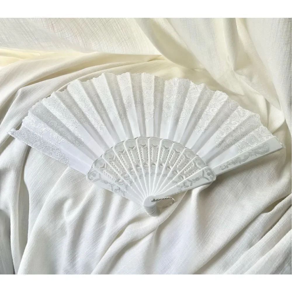 White hand fan with sparkle detailing 